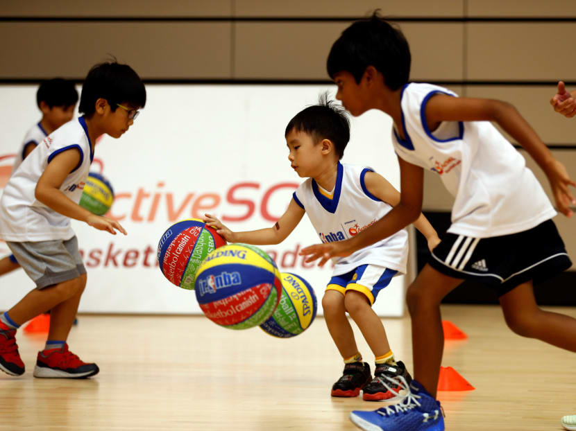 Participants at Saturday's open clinic learning learnt new basketball techniques and training drills. Photo: Sport Singapore