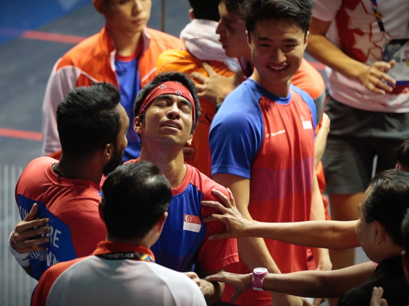 Singapore's Samuel Kang celebrating with his team mates after winning the SEA Games mens squash team finals against the Philippines on August 29, 2017. Photo: Jason Quah/TODAY