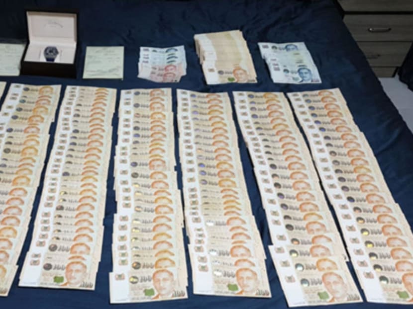The police seized two watches and more than S$81,000 in cash when they arrested the suspect on May 26, 2020.