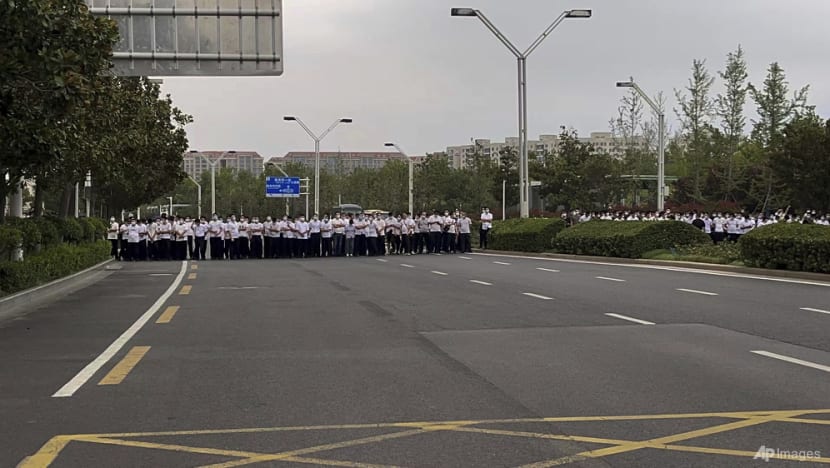 China's Henan bank customers face harassment, job loss over protests China's Henan bank customers face harassment, job loss over protests