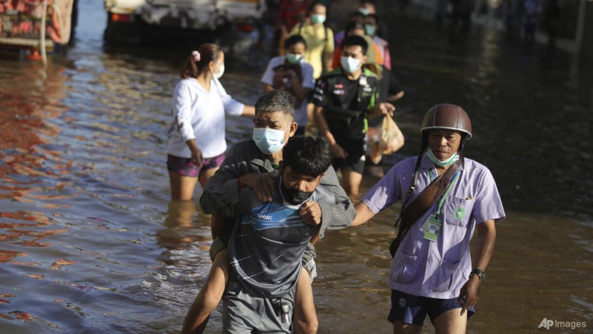 Thai rescuers battle floodwaters to reach dozens stranded in homes