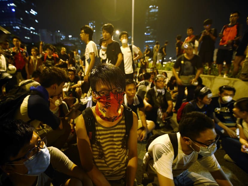 Protesters block a section of an avenue in front of the office of Hong Kong’s Chief Executive Leung Chun-ying in Hong Kong, October 3, 2014. Photo: Reuters