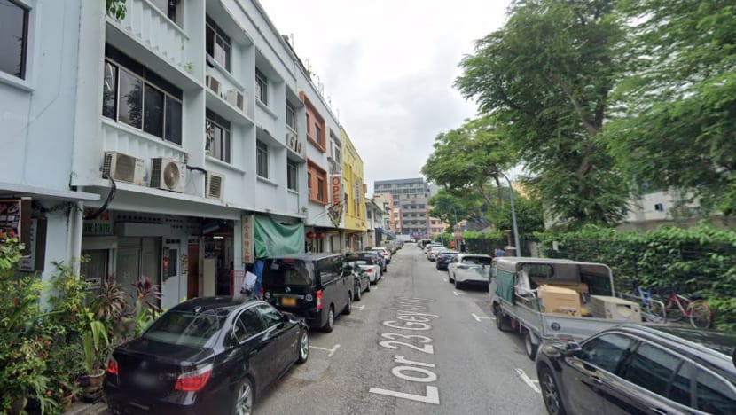 Two men charged after 39 people, including migrant workers, found living in 2 shophouses