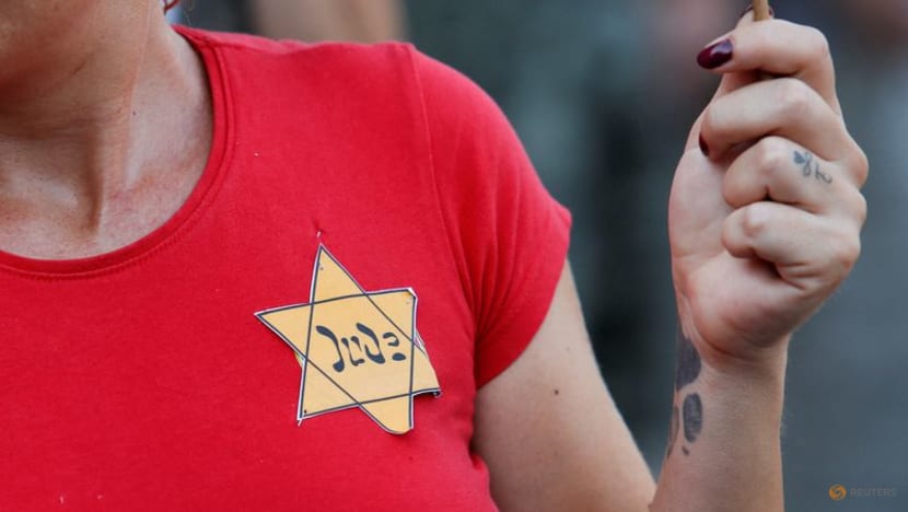 Israel sees Holocaust tropes in COVID-19 protests fuelling anti-Semitism Israel sees Holocaust tropes in COVID-19 protests fuelling anti-Semitism