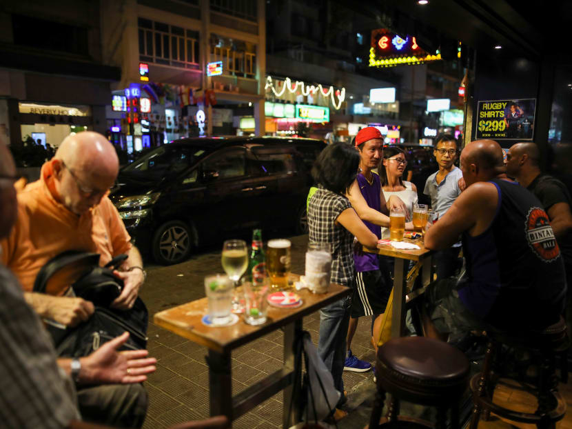 People having a drink at a bar in Hong Kong, China, on Oct 25, 2019.