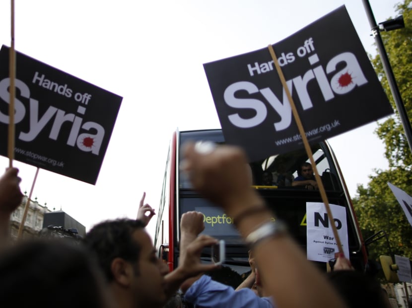 Protestors rally against a proposed attack on Syria in central London. Photo: REUTERS