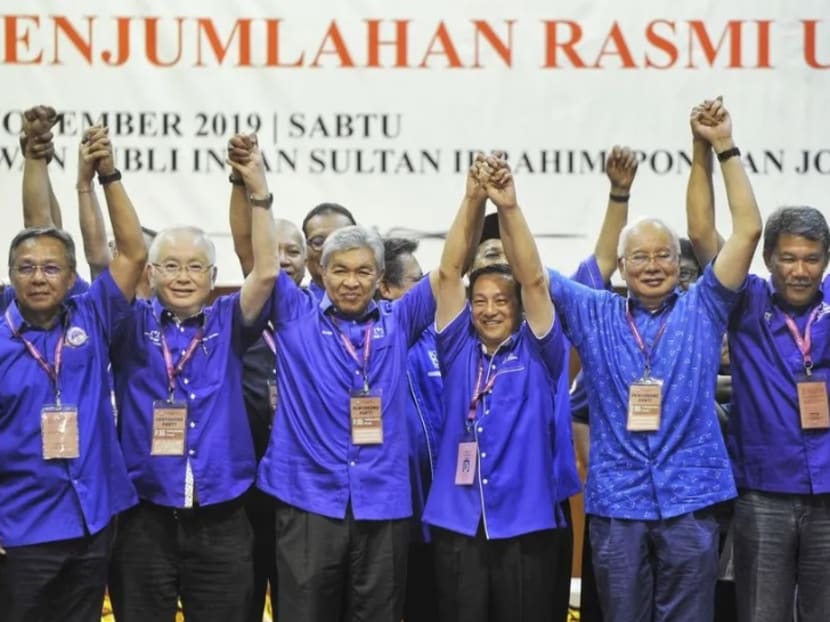 Barisan Nasional leaders, including former Malaysian Prime Minister Najib Razak (right from right), with its winning candidate Wee Jeck Seng (centre) after the results were announced.