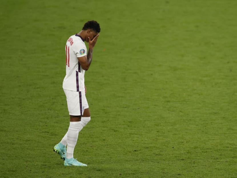 In this file photo England's forward Marcus Rashford reacts after he fails to score in the penalty shootout during the Uefa Euro 2020 final football match between Italy and England at the Wembley Stadium in London on July 11, 2021.