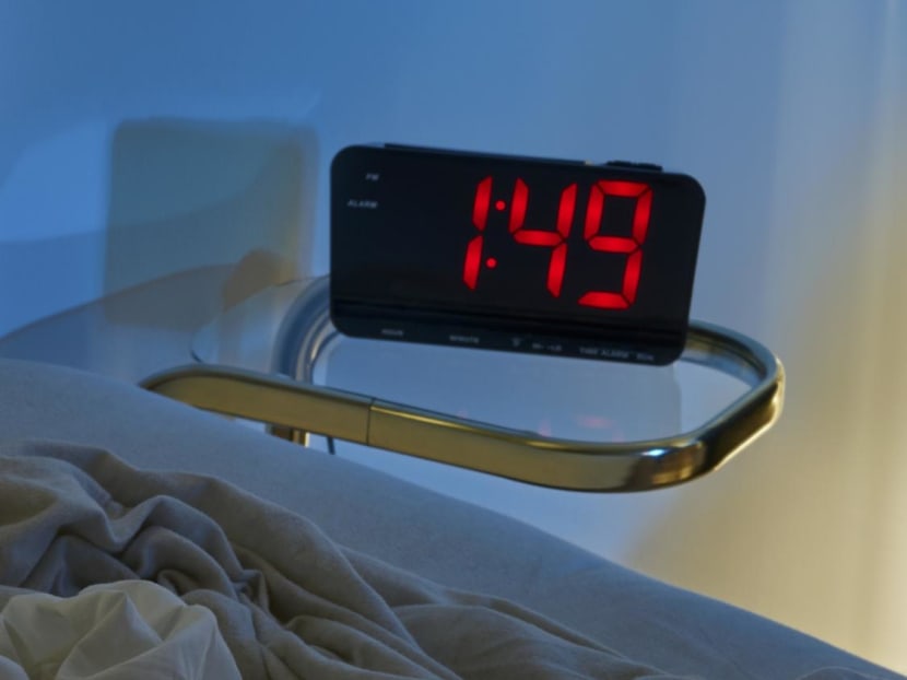 A bedroom clock next to an unmade bed. Research has found that sleep quality does indeed get a little rusty as you grow older, but it's not a fate you have to live with, experts say.