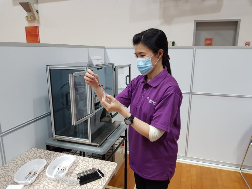 S’pore-developed automated Covid-19 vaccine dispenser deployed to at least 7 vaccination centres S’pore-developed automated Covid-19 vaccine dispenser deployed to at least 7 vaccination centres