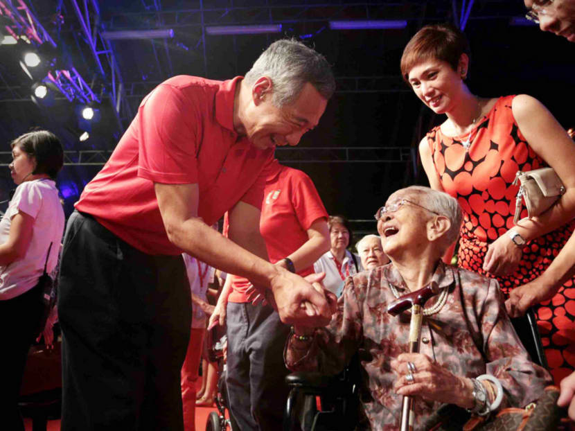 Prime Minister Lee Hsien Loong chatting with Madam Lim Beak, 108, during an appreciation event for Pioneer Generation Ambassadors at Gardens By The Bay on Monday. Photo: Jason Quah
