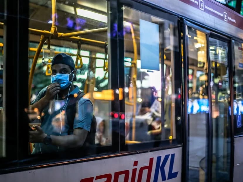 People are seen wearing face masks amid the Covid-19 outbreak in Kuala Lumpur, March 16, 2020.