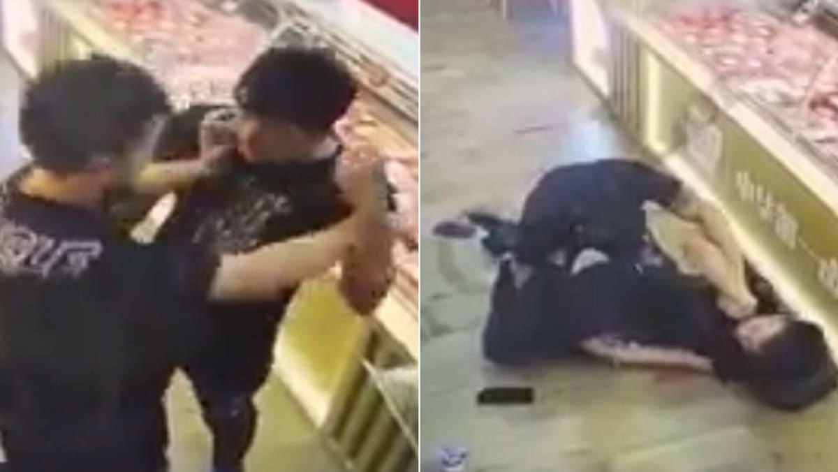 Police investigating case of 2 men filmed fighting in a store on Beach Road