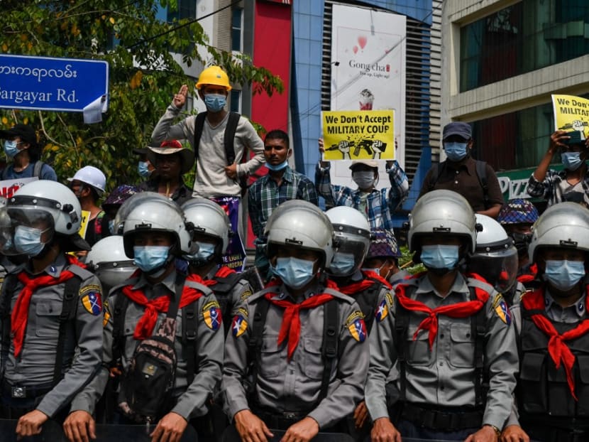 Riot police stand in formation during a demonstration against the military coup in Yangon on Thursday, Feb 18, 2021.