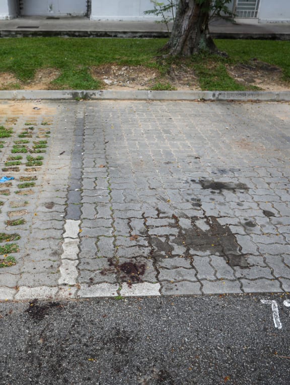 Blood stains at an open-air car park next to Block 176 Boon Lay Drive, seen on April 7, 2022.