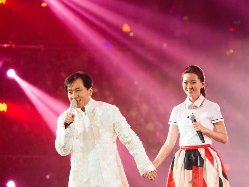 Jackie Chan and Joi Chua perform at a charity concert in Beijing to mark Chan’s 60th birthday.