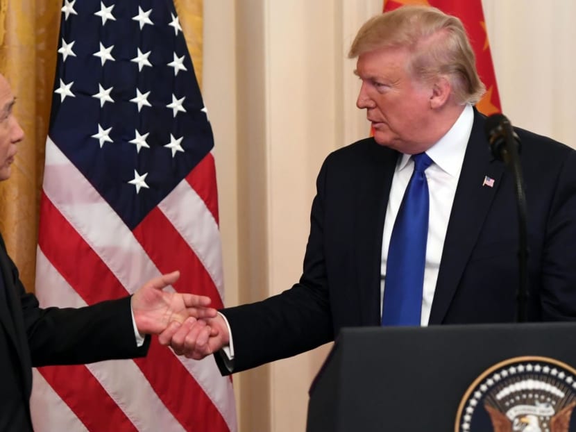 US President Donald Trump, shakes hands with China's Vice Premier Liu He, the country's top trade negotiator, before they sign a trade agreement. US President Donald Trump, shakes hands with China's Vice Premier Liu He, the country's top trade negotiator, before they sign a trade agreement.