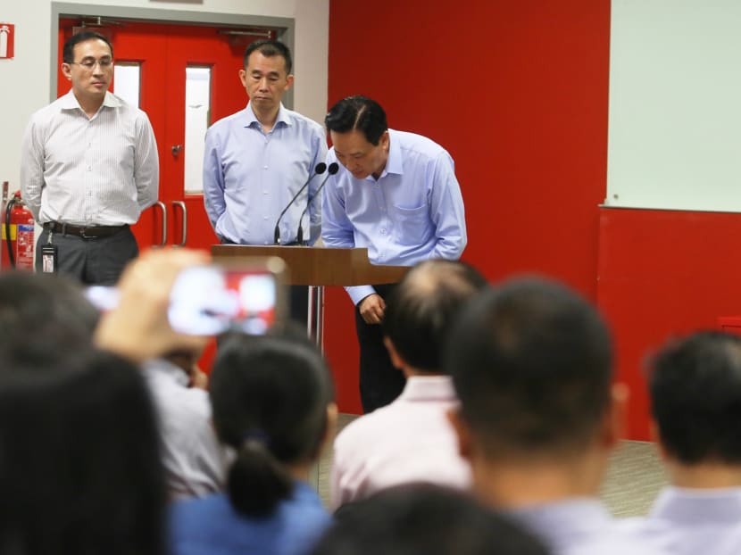 Photo of the day: Chairman of SMRT Corporation and SMRT Trains Seah Moon Ming taking a bow and apologising to the public for the underground flooding incident along the North-South Line (NSL) on Oct 7-8 that resulted in a 20-hour disruption. Looking on (from left) is SMRT Group Chief Executive Officer Desmond Kuek and SMRT Trains' Chief Executive Officer Lee Ling Wee. Photo: Koh Mui Fong/TODAY