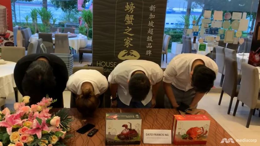 Seafood restaurant CEO bows in apology for live crab claw machine, says approval wasn't given