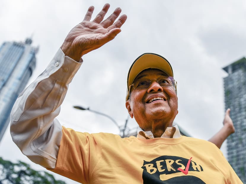 Former Malaysian Prime Minister Mahathir Mohammed waves as he arrives to attend a mass rally organised by Bersih 5.0 calling for the resignation of Malaysia's Prime Minister Najib Razak in Kuala Lumpur on Nov 19, 2016. Photo: AFP