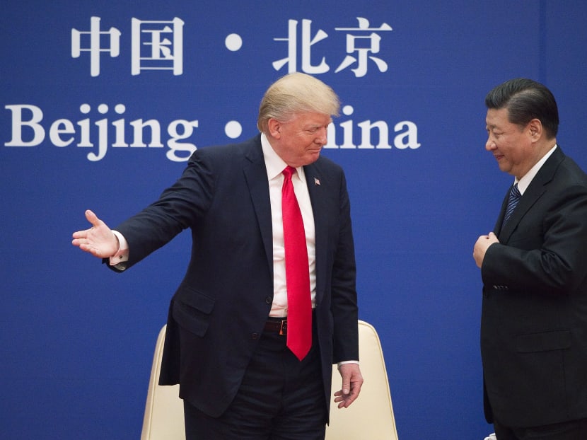 Mr Trump with Mr Xi during the American President's state visit to China in Nov  2017. While both leaders have signalled that they want to cooperate even as they compete, we will face a prolonged period of more than usual uncertainty, says the author. Photo: AFP