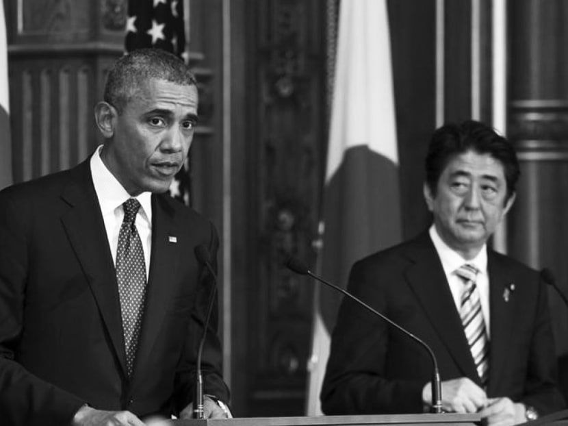 U.S. President Barack Obama attends a news conference with Japanese Prime Minister Shinzo Abe at the Akasaka guesthouse in Tokyo. Photo: Reuters