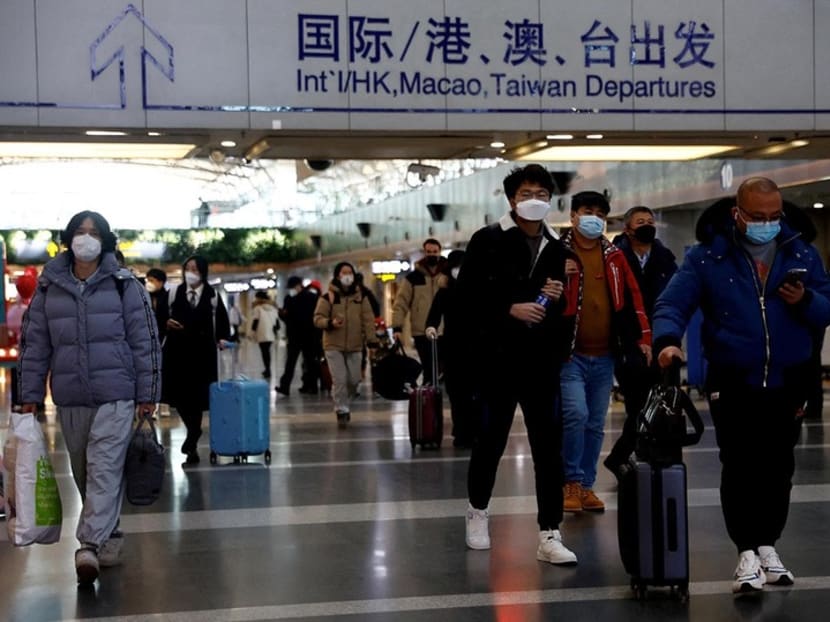 Travellers walking with their luggage at Beijing Capital International Airport in China on Dec 27, 2022. Travellers walking with their luggage at Beijing Capital International Airport in China on Dec 27, 2022.
