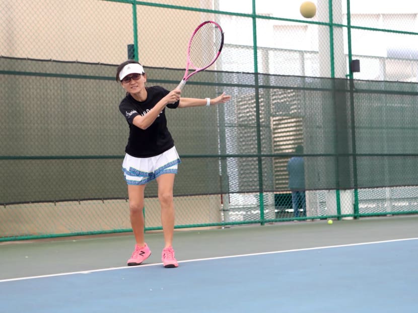 The author playing soundball, or tennis for the blind, using a sound-adapted sponge ball. The author playing soundball, or tennis for the blind, using a sound-adapted sponge ball.