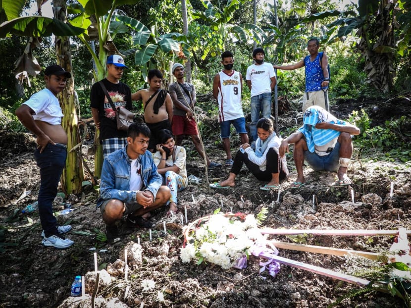 Relatives grieve at a mass burial site where the Sapi family buried seven of their members, victims of the landslide in the nearby village at the height of Typhoon Nalgae, in Datu Odin Sinsuat, Maguindanao, southern Philippines on Oct 31, 2022.
Relatives grieve at a mass burial site where the Sapi family buried seven of their members, victims of the landslide in the nearby village at the height of Typhoon Nalgae, in Datu Odin Sinsuat, Maguindanao, southern Philippines on Oct 31, 2022.