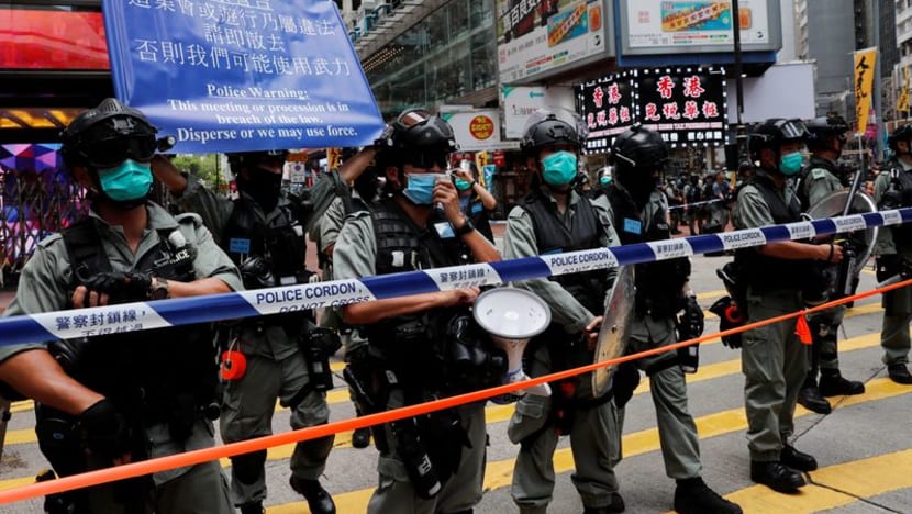 Hong Kong man first charged under security law for motorbike 'attack' Hong Kong man first charged under security law for motorbike 'attack'