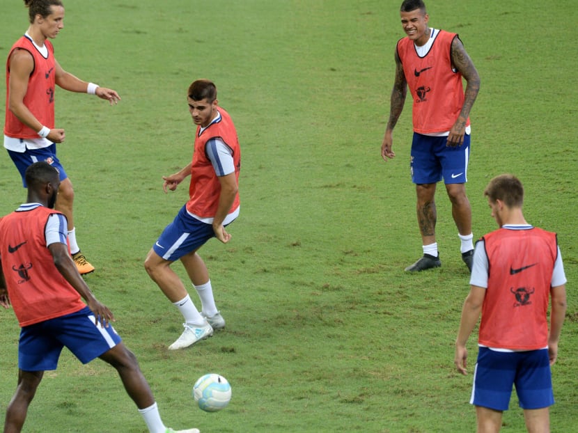 Alvaro Morata (centre) seen here training with the Chelsea football team in Singapore ahead of the match with Bayern Munich on Tuesday (July 25). Coach Antonio Conte said the player would have no trouble adapting to the Premier League. Photo: AFP