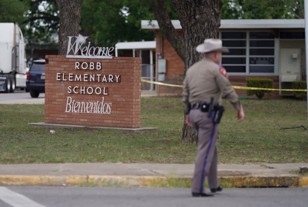 An officer walks outside of Robb Elementary School in Uvalde, Texas, on May 24, 2022. 