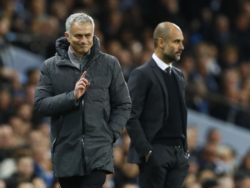Jose Mourinho (left) and Pep Guardiol on the sidelines during the Manchester derby on Thursday (April 27). Photo: Reuters