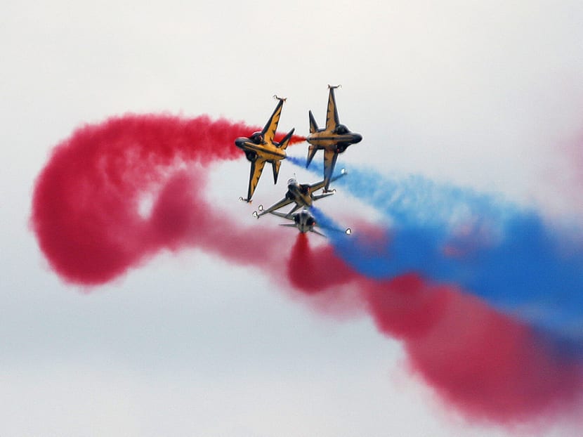 The Republic of Korea Air Force Black Eagles aerobatic team performing an aerial display during the Singapore Airshow 2016 official media conference. Photo: Don Wong