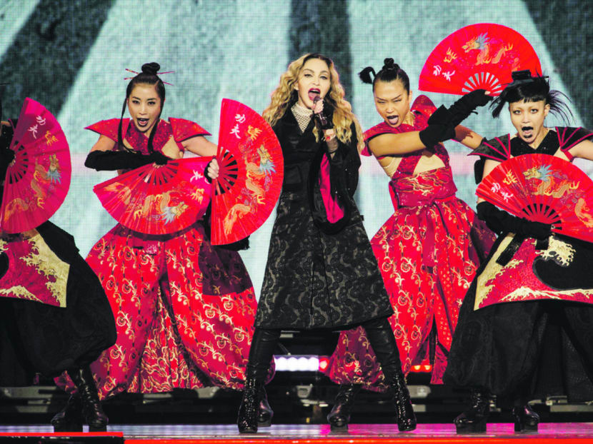 Madonna, center,  performs in concert with dancers during her "Rebel Heart Tour"  in Mexico City, Wednesday, Jan. 6, 2016. (AP Photo/Christian Palma)