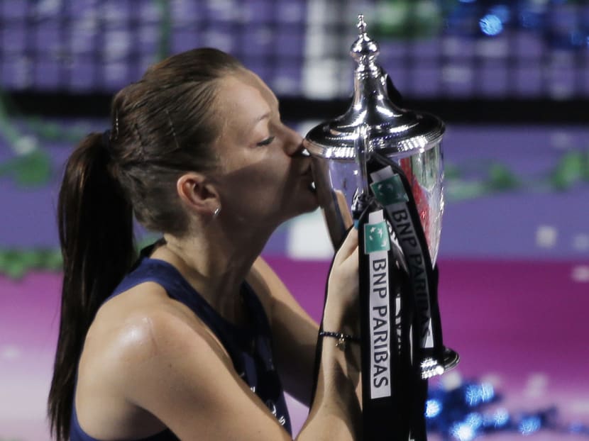 Poland's Agnieszka Radwanska celebrates with the trophy after winning the WTA final. Photo: Action Images via Reuters