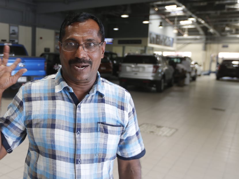 Mohammad Basheer Abdul Khadar, who survived an Emirates crash landing at Dubai airport and later won US$1 million in a lottery, is planning to use the money to help needy children in Kerala. Photo: AFP
