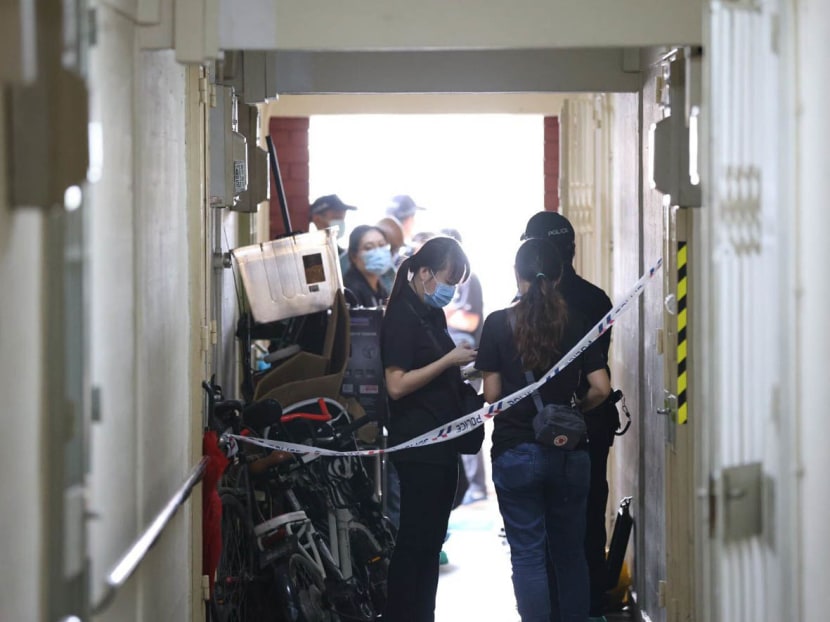 Police officers outside the scene of a murder at a housing block along Redhill Close on March 17, 2023.
Police officers outside the scene of a murder at a housing block along Redhill Close on March 17, 2023.