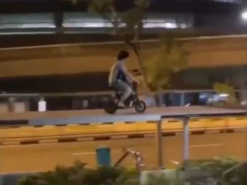 Video footage of the incident shows a man riding an e-scooter on top of a sheltered walkway.
