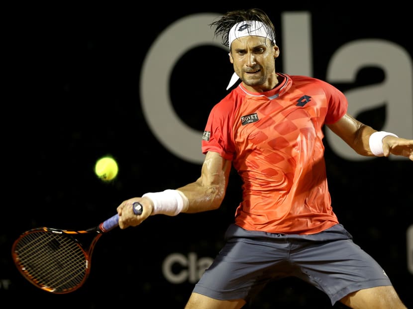 David Ferrer of Spain returns a shot to Fabio Fognini of Italy during the final of the Rio Open at the Jockey Club Brasileiro. Photo: Getty Images