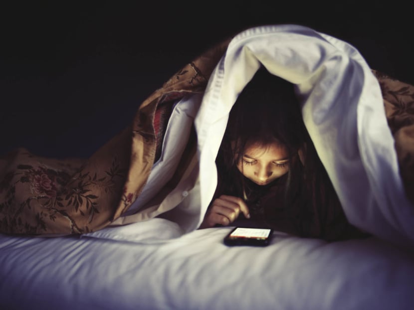 Children who slept in the same room as small screens got almost 21 fewer minutes of shuteye a night than those who didn't, research found. Photo: Bloomberg