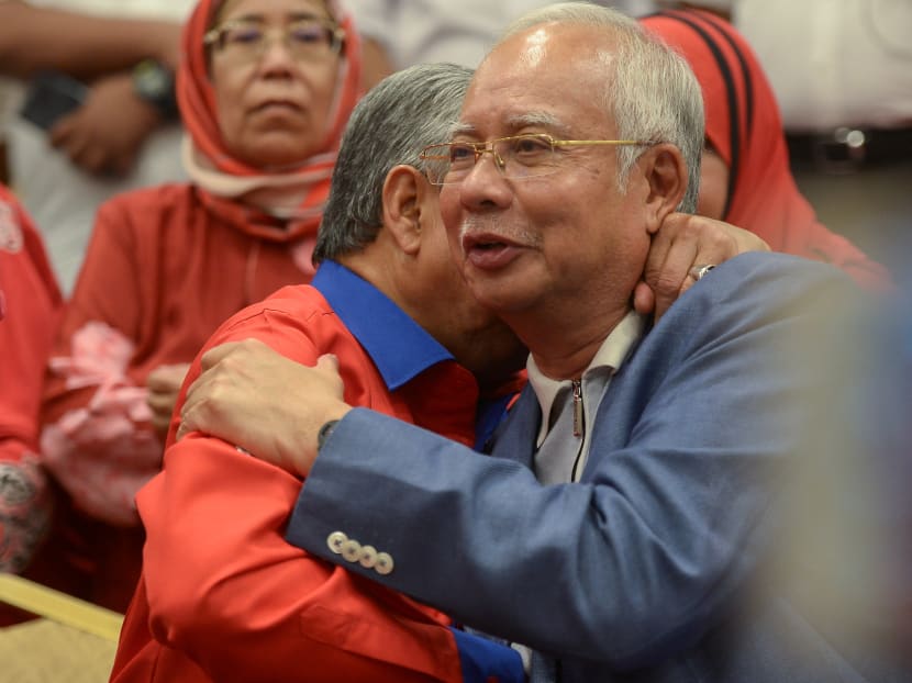 Former Malaysian Prime Minister Najib Razak (right) is hugged by Mr Ahmad Zahid Hamidi, former deputy prime minister, during a news conference in Kuala Lumpur, Malaysia on May 12, 2018.