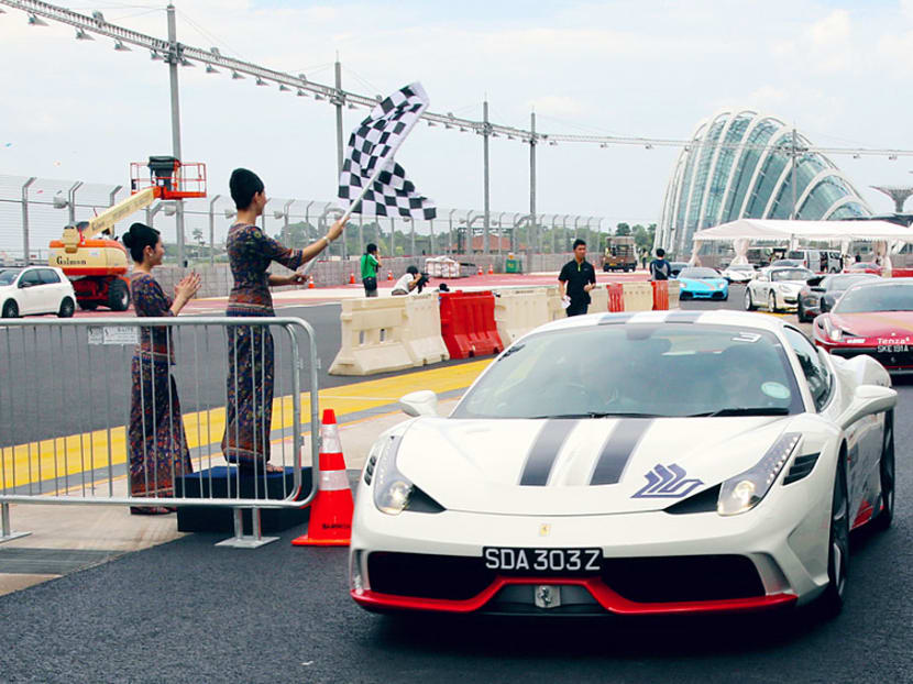Supercars moving off at the SIA Light Up The Night Carnival in 2014. Photo: Singapore Airlines