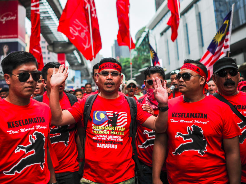 Jamal Md Yunos (Center), marches with his red shirt supporters on the streets of Kuala Lumpur, Malaysia. Photo: AFP