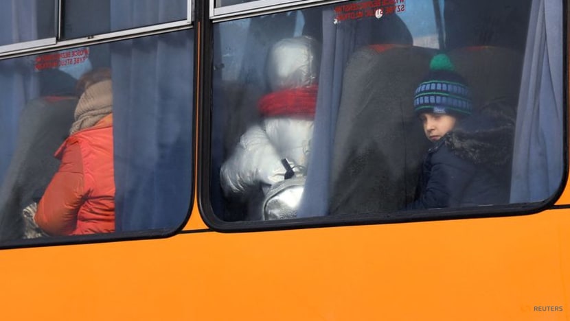 Ukrainians face long journeys to borders as fighting escalates