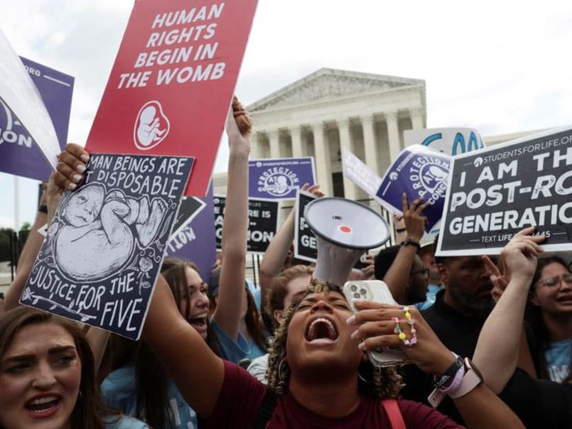 Anti-abortion activists celebrate outside the US Supreme Court on June 24, 2022 after the court overturned the Roe v Wade decision which had given constitutional recognition to women's right to abortion. Pro-choice activists also gathered to oppose the ruling.