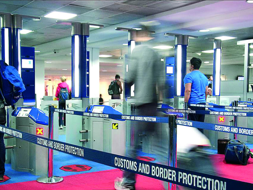 SmartGate operates on facial-recognition technology that matches the image taken of travellers at a kiosk screen with the digital facial image stored in the electronic chip in their biometric passport.  Photo: Australian Customs and Border  Protection Service