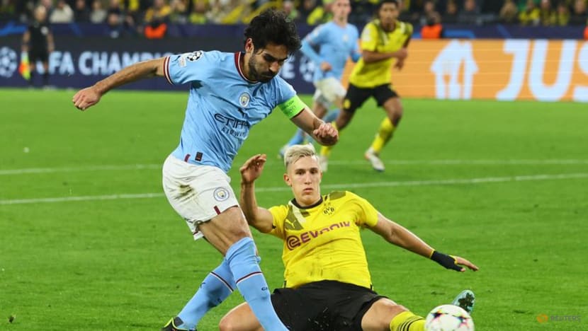 Soccer-Dortmund draw 0-0 with Manchester City to join them in knockout stage Soccer-Dortmund draw 0-0 with Manchester City to join them in knockout stage