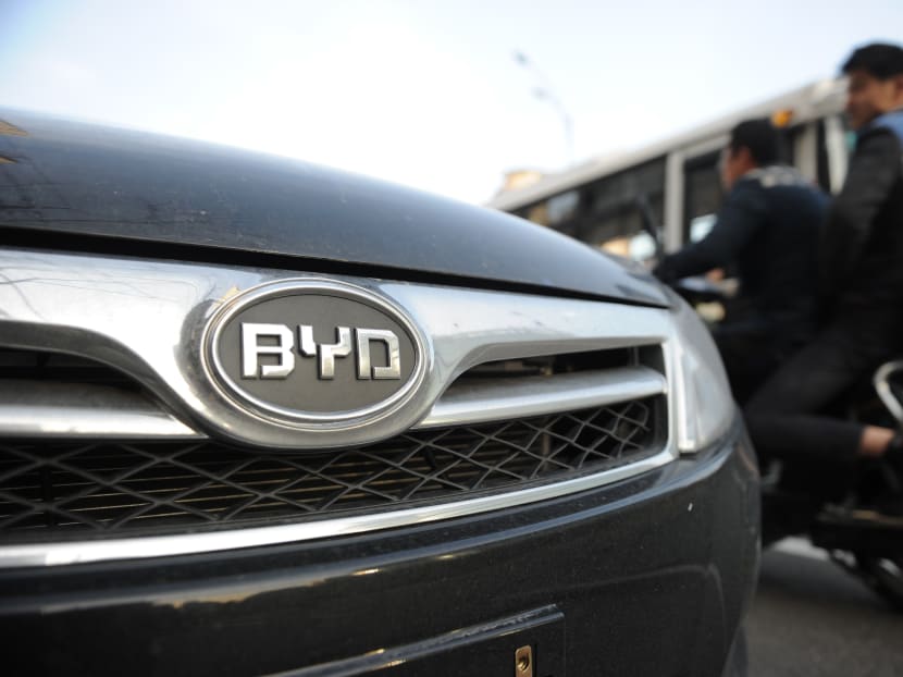 Motorists pass a BYD car on a street in Shanghai on March 25, 2013. AFP file photo