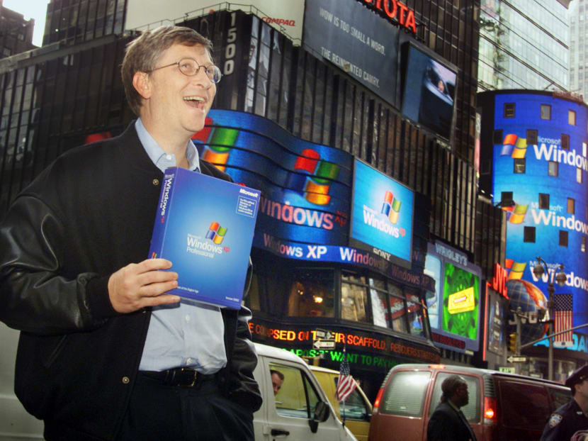 In this Oct 25, 2001 file photo, Microsoft chairman Bill Gates stands in New York's Times Square to promote the new Windows XP operating system. Photo: AP